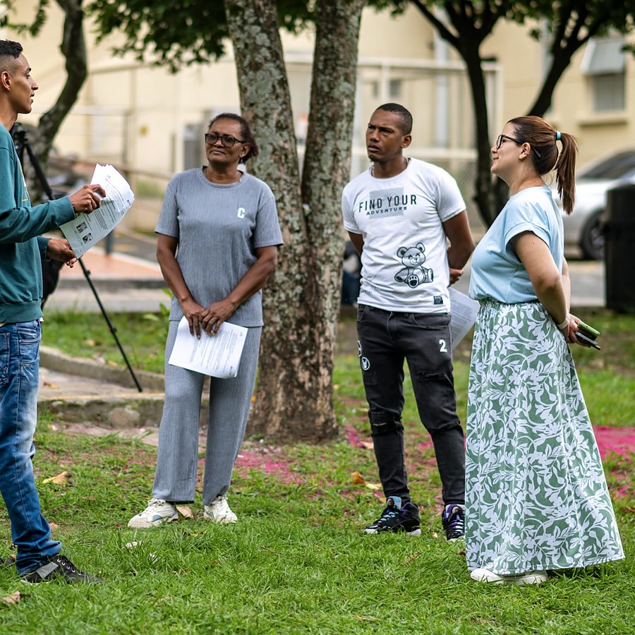 An ACTRA facilitator gathering assessment data with participants in the field